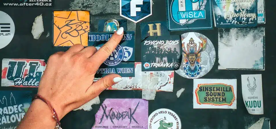 A side-by-side photo of a vibrant, crisp sticker and a cheap, blurry, and faded sticker